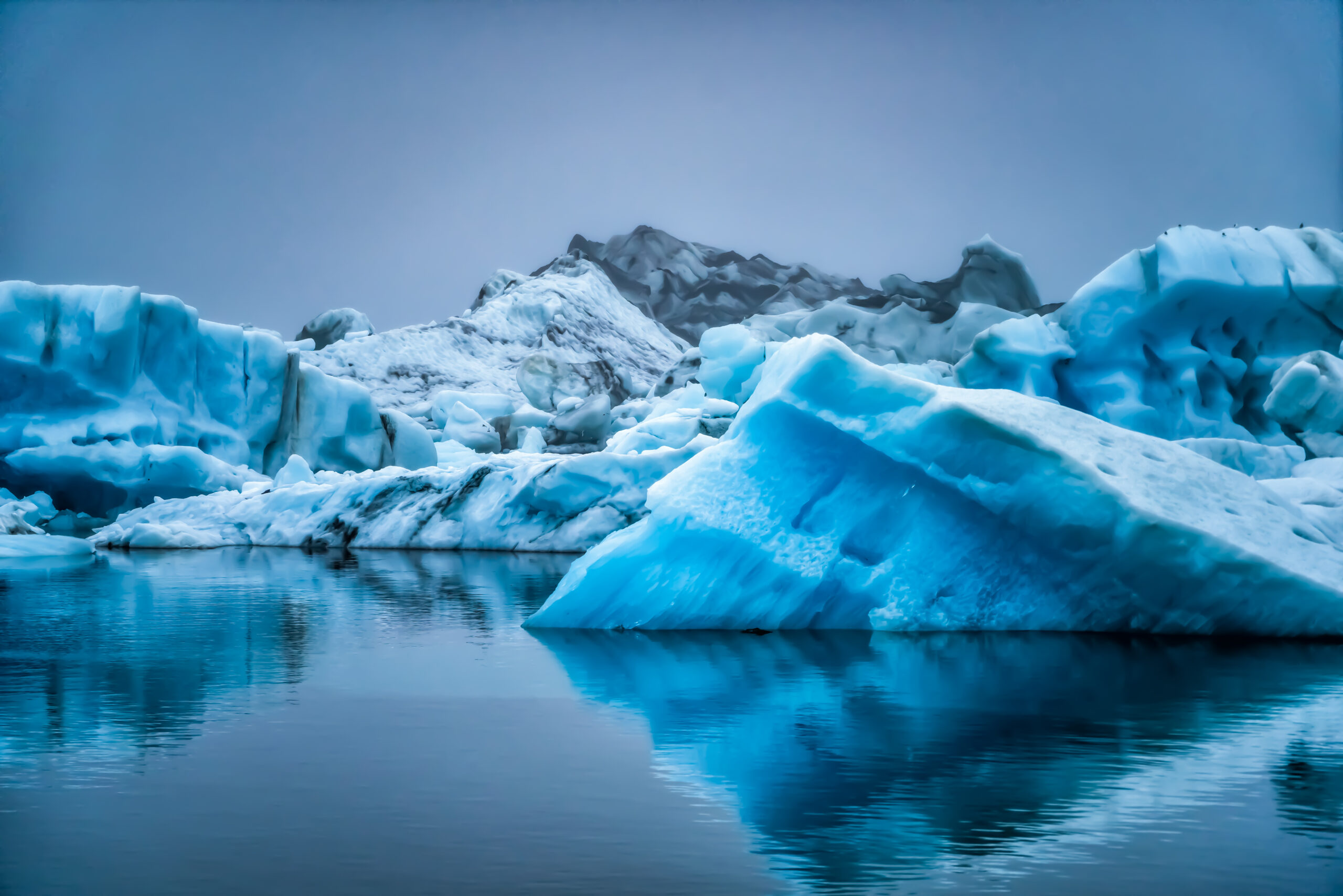 Icebergs in Jokulsarlon beautiful glacial lagoon in Iceland. Jokulsarlon is a famous travel destination in Vatnajokull National Park, southeast Iceland, Europe. Winter landscape.
