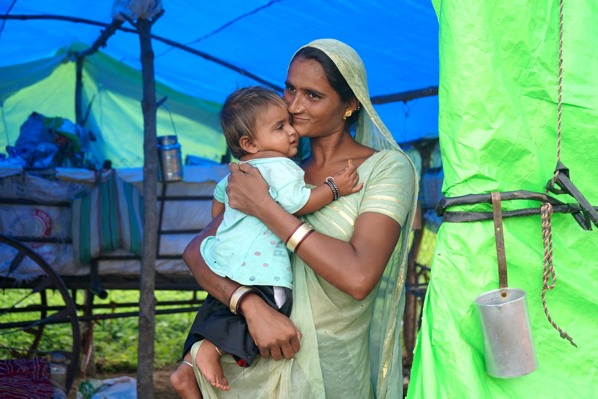 nomadic-tribe-woman-with-baby-at-the-tent-india-.jpg